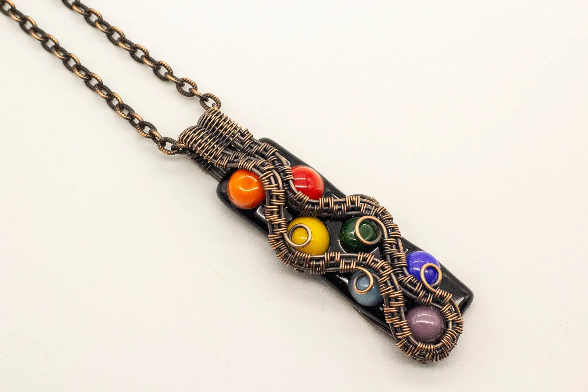Chakra-inspired Fused Glass Pendant with Copper Wire Wrapping