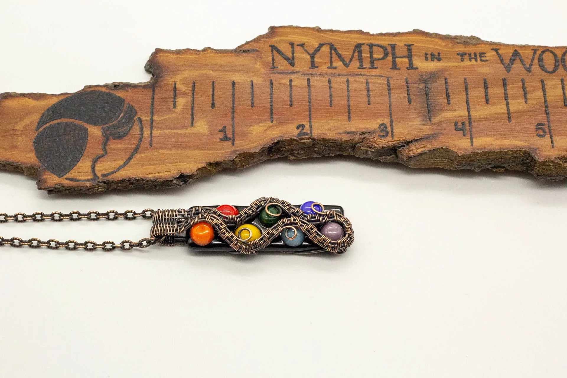 Chakra-inspired Fused Glass Pendant with Copper Wire Wrapping