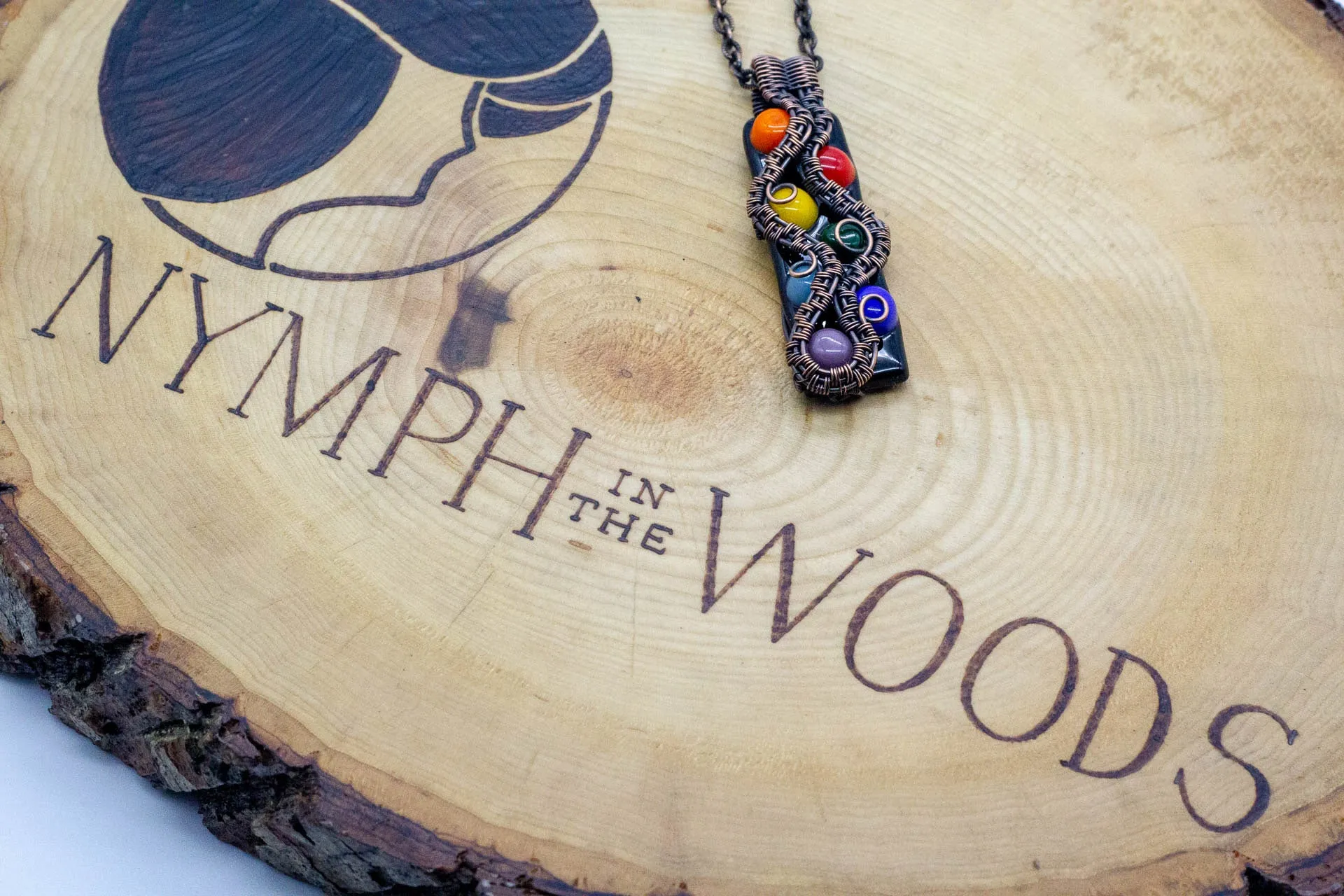 Chakra-inspired Fused Glass Pendant with Copper Wire Wrapping