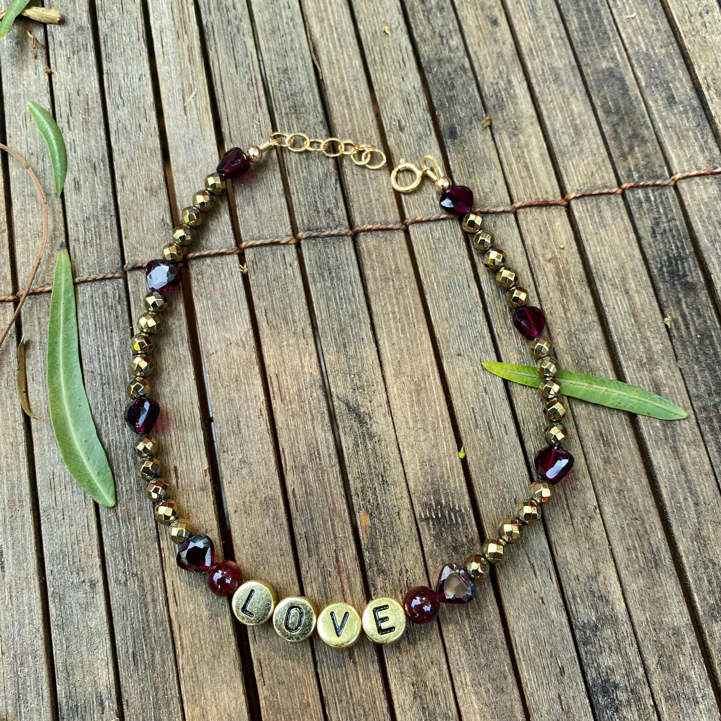 Garnet and hematite beaded gemstone “love” anklet with heart shaped garnets