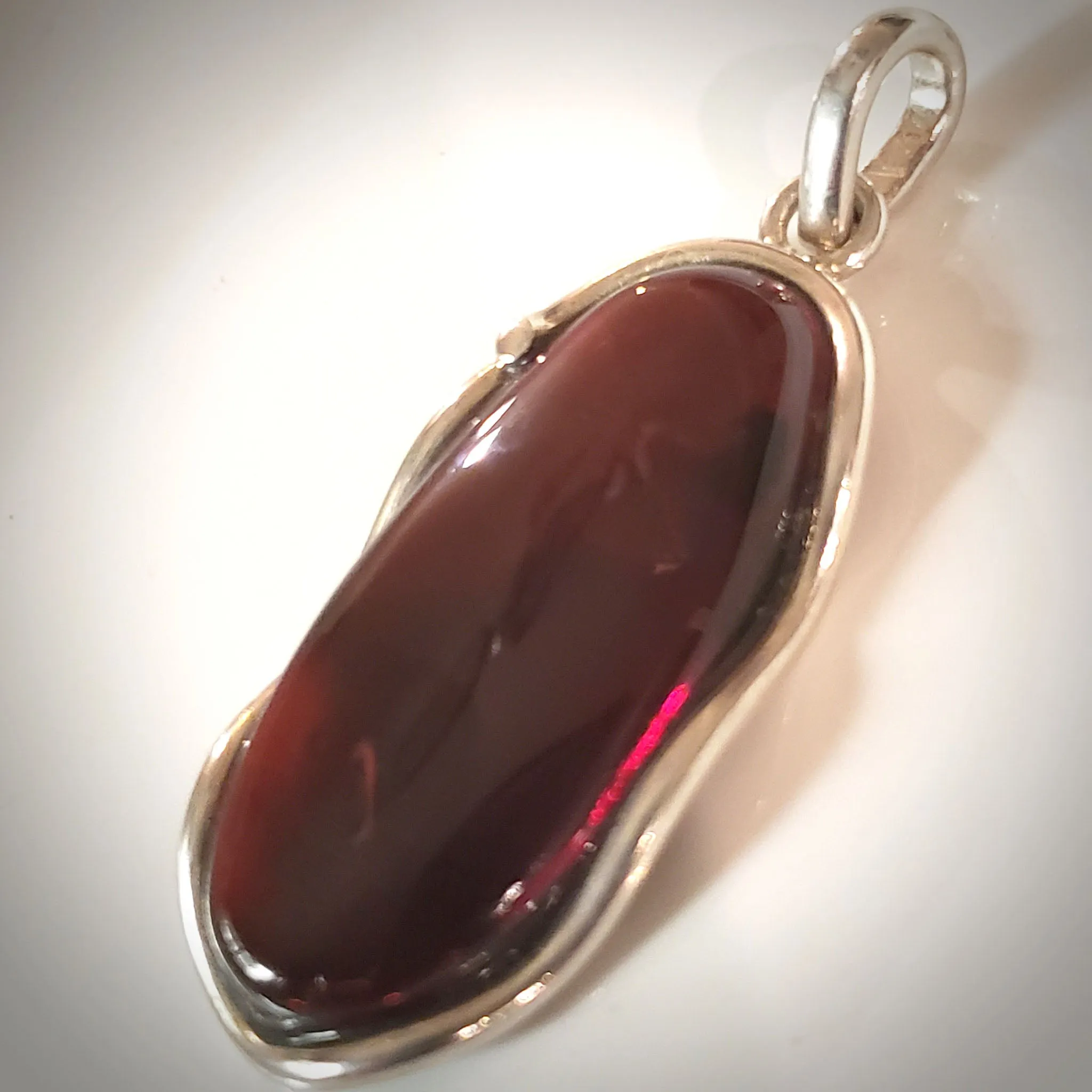 Large Oval Red Cherry Amber Pendant in Modern Sterling Silver